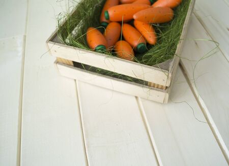 Carrot made of wood. A toy for a child. Easter holiday.の写真素材