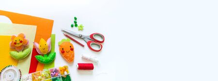 Carrot and flower made of felt. Toy Easter holiday rabbit. Material for a creative person.