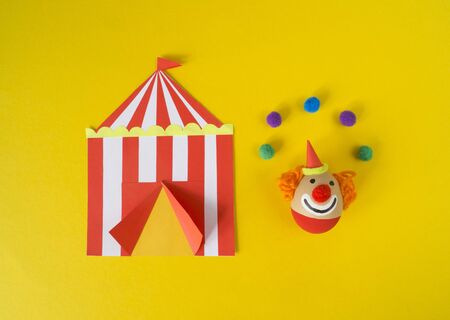 Easter circus. Egg with a funny face. Doll for the holiday. Fun for kids to colorize.の写真素材