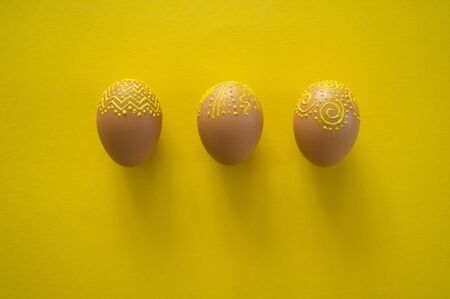 Easter eggs pattern. Volumetric yellow paint. Children's creativity