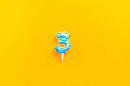 Candle number. Donut holiday Yellow background Birthday.の写真素材