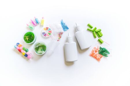 DIY slime. Ingredients and decorations for slimes. Jars of sequins and beads