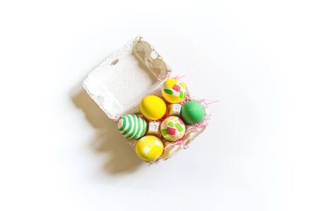 Painted Easter eggs in a box. Watercolor paint. Delicate spring color. White background