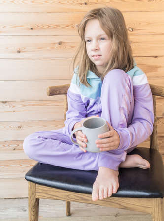 Coronavirus child girl. Looks up. Pandemic in the city. Stay at homeの写真素材