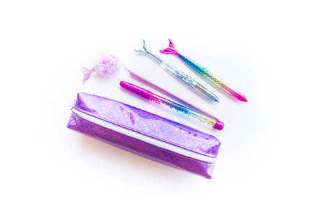 Stationery mermaid purple. School pencil case. White background. Back to school.