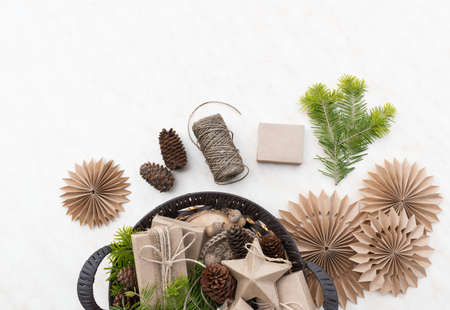Zero waste Christmas concept. Wicker basket Hand crafted gifts with natural Christmas decorations...