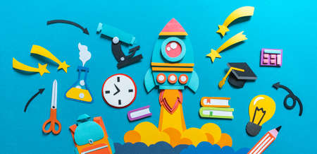 Rocket takes off paper craft. Back to school. Copy space. Blue background. Education concept bannerの写真素材