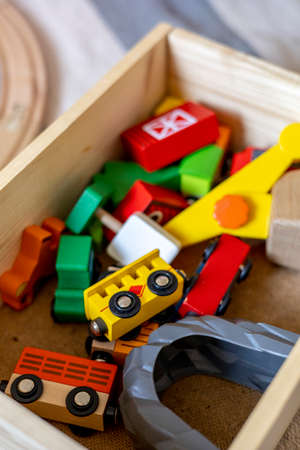 Wooden railroad and trains are in a box. Montessori material. Home schooling concept. Eco friendly toyの写真素材