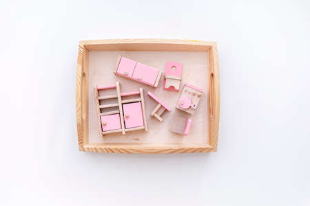Montessori material is wooden. Toddler education concept. Eco friendly toy. Dollhouse furnitureの写真素材