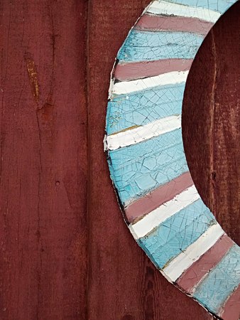 old wheel on painted wallの写真素材