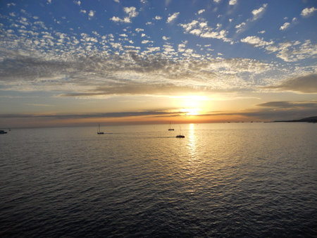 ships on the background of the sunset at seaの写真素材