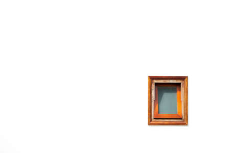 Open brown, wooden, faded, old window isolated on white wall background.の写真素材
