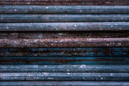 Stack of old rusty aged metal iron plumbing pipes. Background. Texture. High quality photoの写真素材