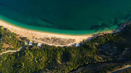 Aerial view of blue Atlantic ocean, green forest mountains and sandy Praia do Portinho da Arrabida beach. Serra da Arrabida, Portugal.の写真素材