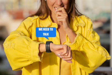 Relationship problems. Problems with parents. Young woman got a message that they need to talk.の写真素材
