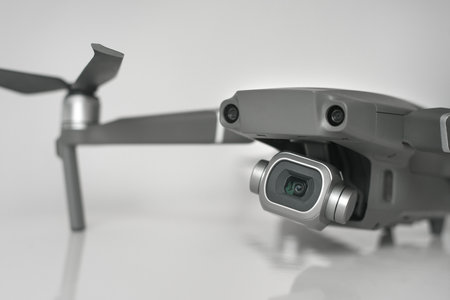 Close up of new dark grey drone with high resolution digital camera and sensors isolated on gray...