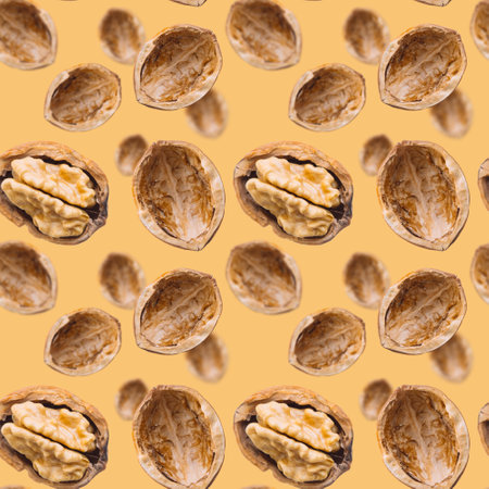 Walnut seamless pattern on brown background. Open nut shell and kernel. Top view of nuts. Banner. Pop art design.の写真素材