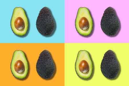 Fresh ripe green avocado isolated on multicoloured background. Top view. Flat lay. Pop art design. Creative summer food backgroundの写真素材