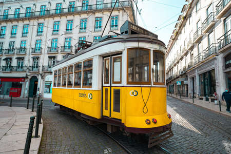 Trams in Lisbon. Tourist attraction. A famous yellow tram in old town of Lisbon, Portugal. 10.03.2020のeditorial素材