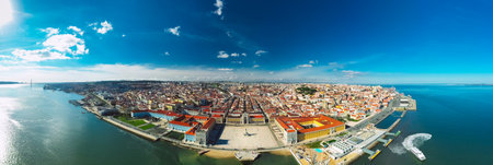Aerial panoramic view of Lisbon city old town at sunny day. Commerce Square or Praca do Comercio in Lisbon, Portugal. 10.03.2021のeditorial素材