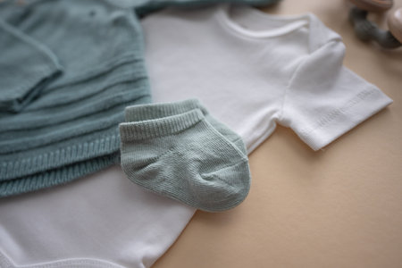 Cute green socks for newborn baby. Baby clothing and happy motherhood concept.の写真素材