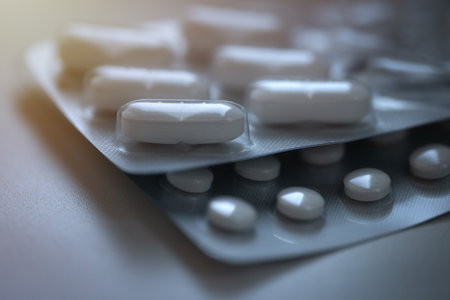 Closeup of pills in blister pack. Headache pills, painkillers, antibiotics or antidepressants...