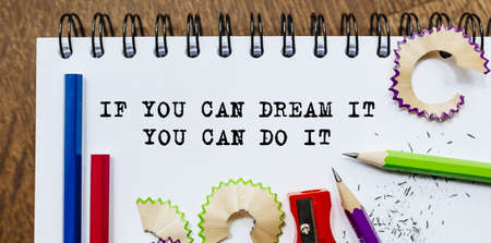 If you can dream it you can do it text written on a paper with pencils in officeの写真素材