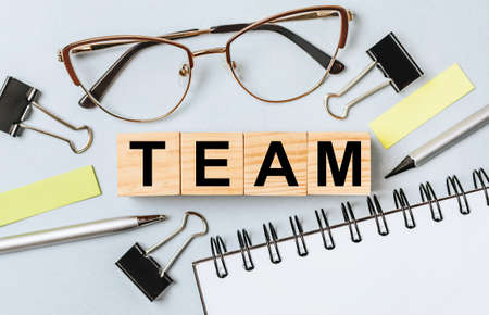 TEAM word on wooden cubes on office deskの写真素材