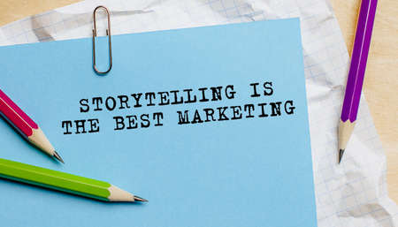 Storytelling is the best Marketing text written on a paper with pencils in officeの写真素材