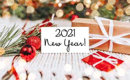 Merry christmas and merry new year concept with gift boxes and greeting card with text 2021 New Yearの写真素材