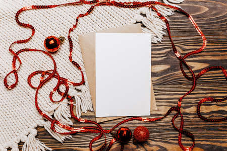 Blank note on wooden and knitted background. Merry christmas and new year conceptの写真素材