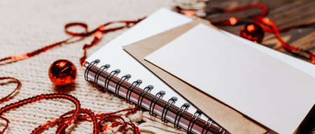 Blank note on wooden and knitted background. Merry christmas and new year conceptの写真素材