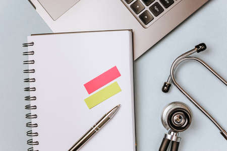 Medical concept flat lay with stethoscope, cardiogram and medical prescription on the doctor desktopの写真素材