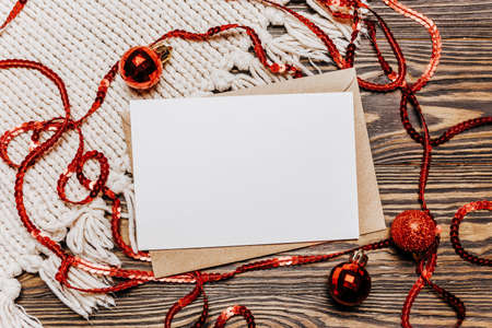 Blank note on wooden and knitted background. Merry christmas and new year conceptの写真素材