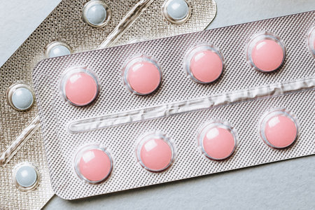 Medical concept flat lay with pills on a blue backgroundの写真素材