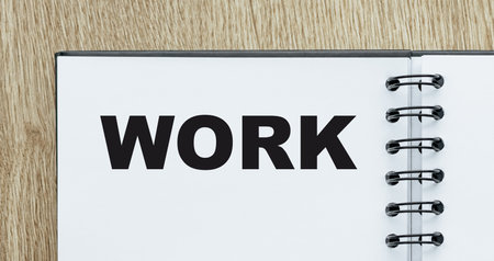 Work. Word in a notebook on a white sheet at the workplace in the office.の写真素材