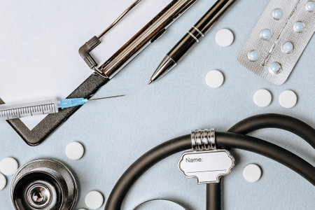 Medical concept with stethoscope, pills, notepad, pen on the doctor desktopの写真素材
