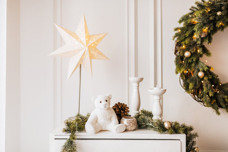 Christmas decorations at home. New year lights, toy, wreath and tree Noelの写真素材