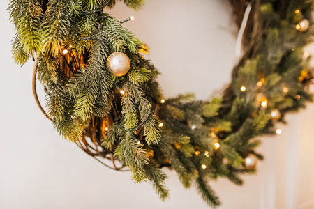 Christmas decorations at home. New year lights, toy, wreath and tree Noelの写真素材