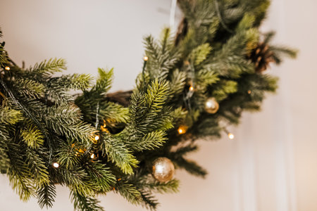 Christmas decorations at home. New year lights, toy, wreath and tree Noelの写真素材