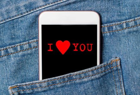 I love you on background phone on jeans love and valentine conceptの写真素材
