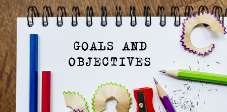 Goals Objectives text written on a paper with pencils in officeの写真素材