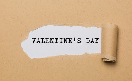 Valentine Day on torn paper background love and valentine conceptの写真素材