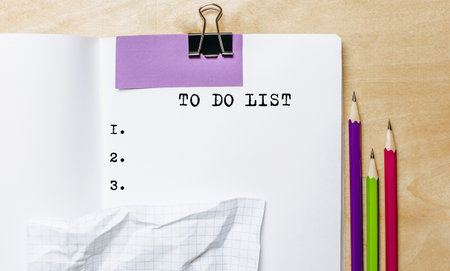 TO DO LIST text written on a paper with pencils on the desk in the officeの写真素材