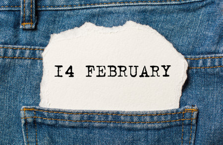 14 february on torn paper background on jeans love and valentine conceptの写真素材