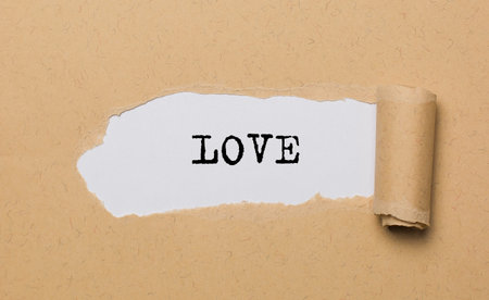 love on torn paper background love and valentine conceptの写真素材