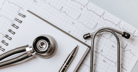 Medical concept flat lay with stethoscope, cardiogram and medical prescription on the doctor desktopの写真素材
