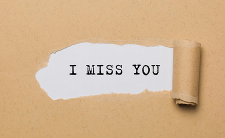 I miss you on torn paper background love and valentine conceptの写真素材
