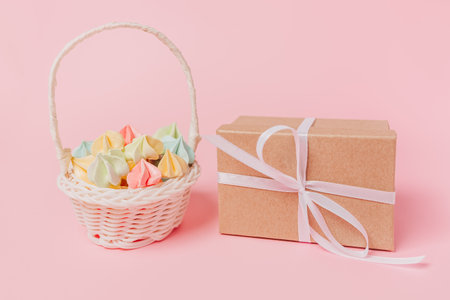 Gifts with sweets on isolated pink background, love and valentine conceptの写真素材