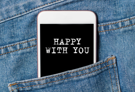 happy with you on background phone on jeans love and valentine conceptの写真素材